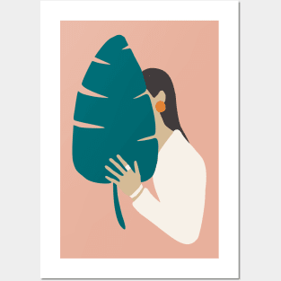 Brunette girl in white with tropical banana leaf Posters and Art